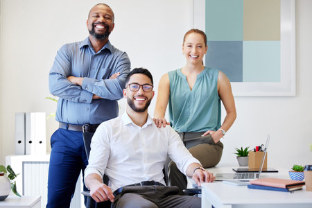 Were the team in charge. a diverse group of businesspeople posing together in the office.の写真素材