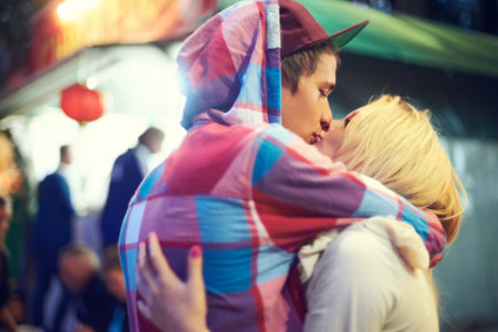 Their love is vibrant. an affectionate couple having a good time at an outdoor festival.の写真素材