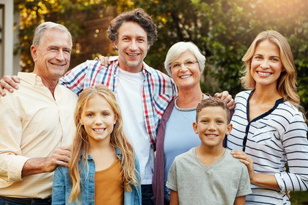 Every family has a story to tell. Portrait of a happy three generational family outdoors.