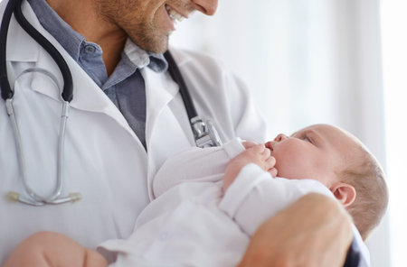 Doctor, pediatrician and holding baby in arms for hospital assessment, medical support and growth....