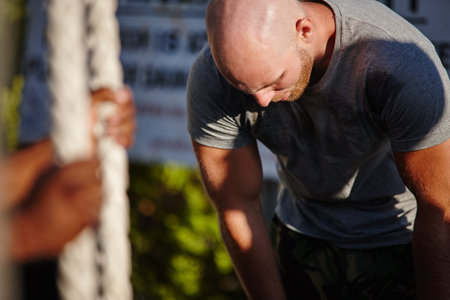 When you train push through the pain. a man at bootcamp looking exhausted.