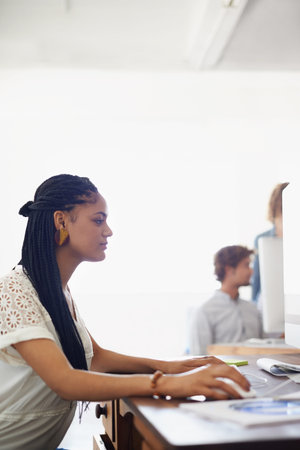 Journalist, office or girl typing on computer working on email, business project or online research....