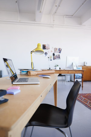 Empty office, startup or laptop on wooden table in workplace, company or workspace for business....