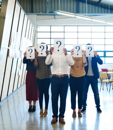 Business, team and group with question mark, poster and ideas with branding, negotiation and solution in the workplace. Staff, coworkers and men with women, asking and confusion with problem solvingの写真素材