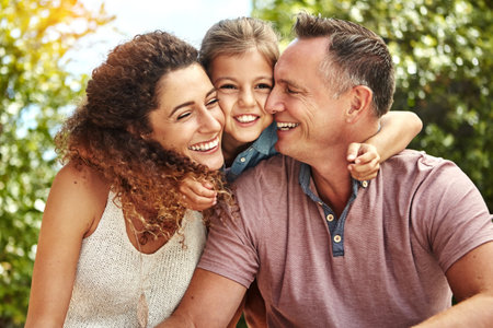Spending time with whats most important in life. a family of three enjoying a day outdoors.の写真素材