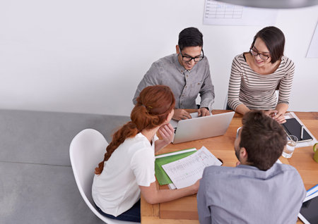Team of creative people in business meeting with collaboration, project planning and top view....
