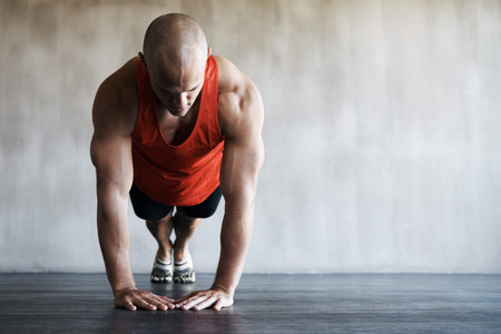 Workout, gym and man in floor push up for exercise, health commitment or training for muscle growth....