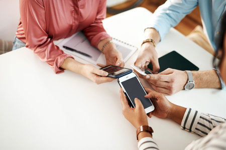 We achieve great things with technology and our minds. an unrecognizable group of businesspeople...