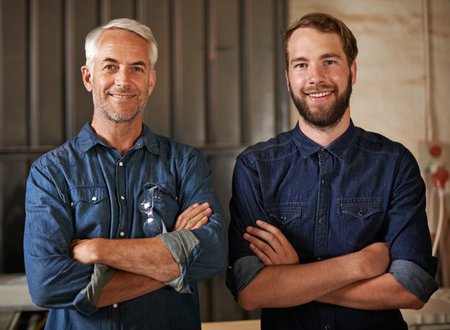Carpenter, happy portrait and arms crossed of architecture team with a smile from startup. Entrepreneur, partnership and architect workers together with pride and success from small businessの写真素材