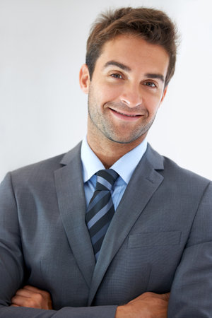The modern professional. a handsome young businessman at work.の写真素材