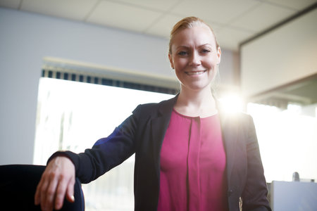 Positive about the career path Ive chosed. Portrait of an attractive businesswoman standing in the...