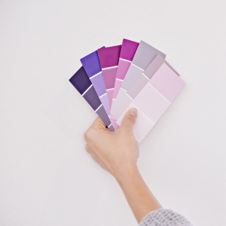 Add some color to your life. a woman holding a color swatch.の写真素材