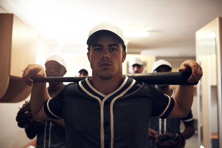 We played a mean game out there. a group of young men walking into a locker room at a baseball game.