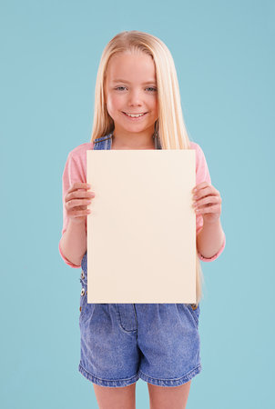 Heres what I think...A cute little girl holding up colorful copyspace while isolated.の写真素材