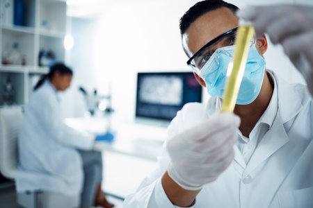 Youre almost ready to be approved. a young scientist conducting medical research in a laboratory.の写真素材