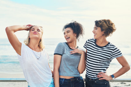 Shes always so dramatic. three friends spending the day together on a sunny day.の写真素材