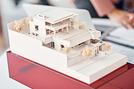We bring ideas to life in this industry. a scale model of a modern house in an architects office.の写真素材