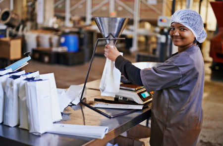 Now thats what I call fresh. a worker in a coffee packaging and distribution warehouse.の写真素材