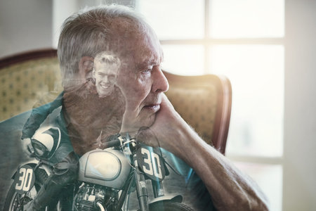 Those were the days...Superimposed shot of a senior man sitting by himself.