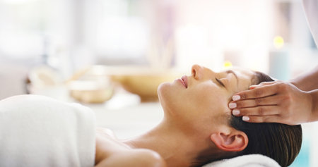 Woman, hands and sleeping at spa for facial treatment, healthy wellness or physical therapy at resort. Calm female person relaxing in peaceful sleep for luxury body care or face massage at the salonの写真素材
