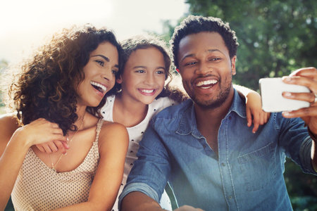 Family, selfie and garden with mom, dad and child together with happiness and smile. Backyard, laugh and profile picture for social media of love, support and parent care with youth and sunshineの写真素材