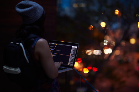 She found another online victim. a young hacker using a laptop.の写真素材