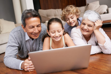 Laptop, relax or grandparents with happy kids for movie streaming online subscription in a family at...