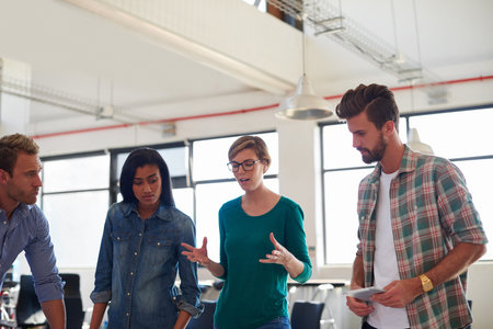 An informal business meeting. A group of informal businesspeople in a meeting.