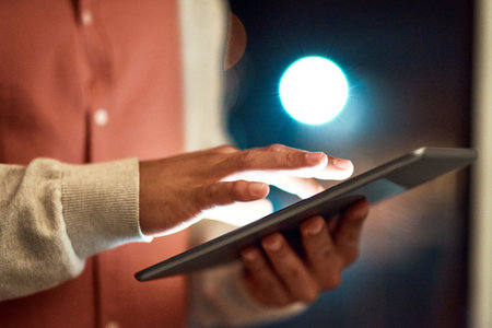 Your online presence is whatll change the game for you. an unrecognizable businessman using a digital tablet while standing outside.の写真素材