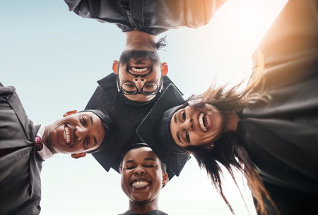 Student group, graduation and face portrait of college friends with smile and pride outdoor. Below diversity men and women excited for university achievement, education success and graduate futureの写真素材