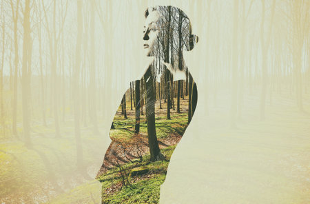 Forest, double exposure and woman thinking in nature or environment with overlay of woods or trees in the background. Illustration, creative and female person outdoor for creativity and reflectionの写真素材