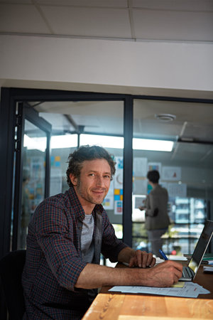 Youve gotta put the work in. Cropped portrait of a businessman working in his office.