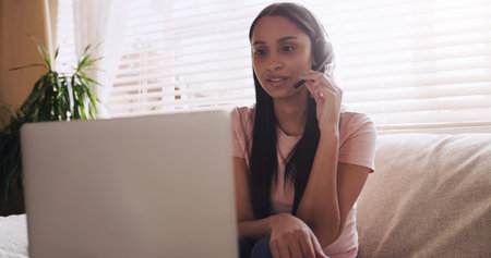 This clients problem should be a breeze to handle. a young female teleworker working as a call...