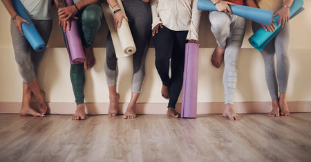 Another yoga day done and dusted. an unrecognizable group of yogis sitting together and bonding...