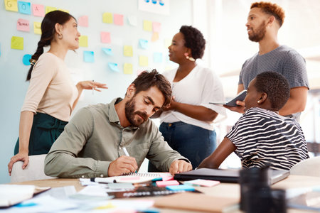 Creative thinkers thrive in an environment like this. a group of young creatives working together in...