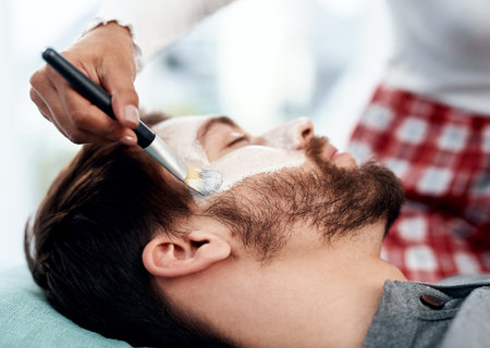 Dont let lockdown dull your skin. a young couple getting homemade facials together at home.の写真素材