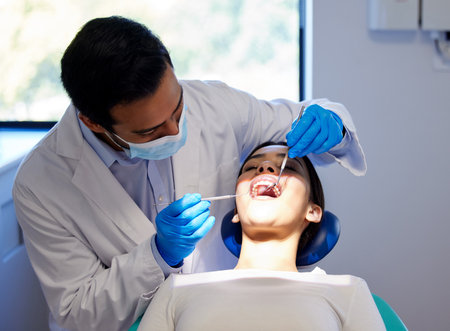Love your smile, love your life. a young woman having a dental procedure performed on her.の写真素材