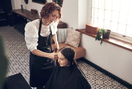 Having a bad day Go see your stylist. a beautiful young woman doing her hair at the salon.