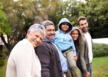 Big family, portrait and generations in park with kid, parents or grandparents for love, care and...