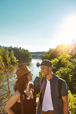 This is where our love story started. a young couple out on an adventurous date in the mountains.の写真素材