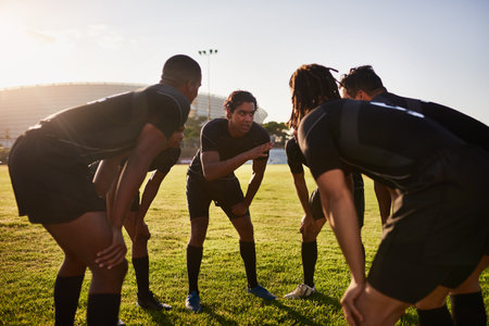 How are we going to win. a diverse group of sportsmen huddled together before playing a game of rugby.の写真素材