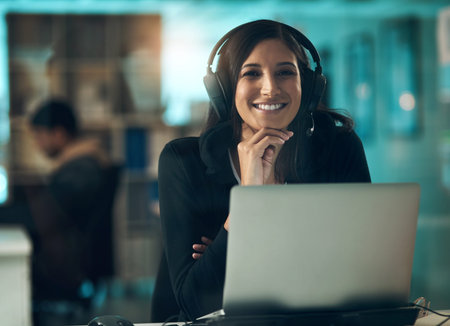 May my existence repeat on you. Portrait of a young woman using a headset in a modern office.