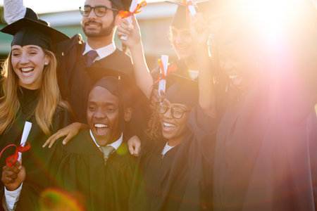 The future never felt more exciting. a group of university students celebrating their graduation.の写真素材