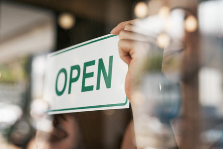 Open, sign and window with hands of person for coffee shop, restaurant and retail. Shopping, start...