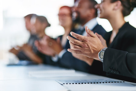 Good presentations deserve an applause. a group of unrecognizable businesspeople applauding at a conference.の写真素材