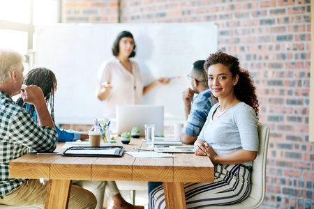 You just have to believe in yourself. Portrait of a businesswoman sitting in a meeting in the...