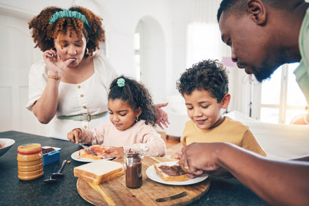 Love, black family and breakfast for nutrition, quality time and wellness in kitchen, happiness and joyful. Parents, mother and father with children, kids and start day with meal, health and happyの写真素材