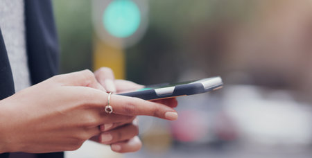 Phone, office and hands of business woman online for social media, internet and connection. Communication, corporate workplace and female person on smartphone for website, mobile app and networkingの写真素材