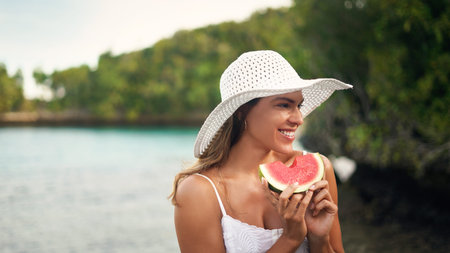 Woman, watermelon and holiday outdoor with a smile by the sea on a summer vacation. Happiness,...