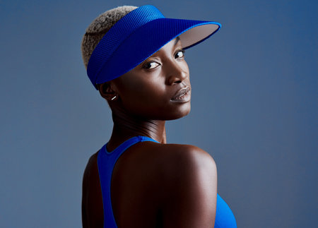 Never stop working on a better you. Studio shot of a sporty young woman wearing a visor while posing...